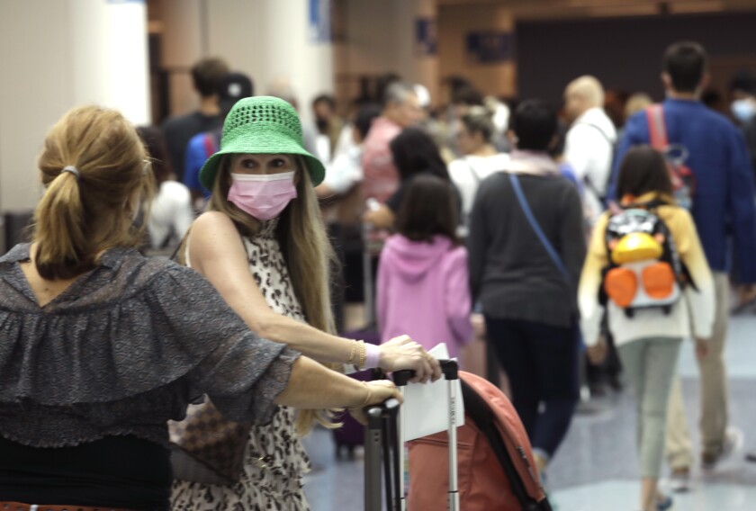 Travelers begin their Memorial Day getaway at the Los Angeles International Airport in May. 