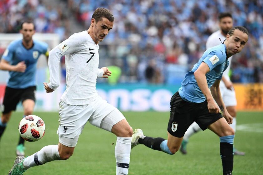 France's forward Antoine Griezmann (L) vies with Uruguay's defender Diego Laxalt during the Russia 2018 World Cup quarter-final football match between Uruguay and France at the Nizhny Novgorod Stadium in Nizhny Novgorod on July 6, 2018. / AFP PHOTO / FRANCK FIFE / RESTRICTED TO EDITORIAL USE - NO MOBILE PUSH ALERTS/DOWNLOADSFRANCK FIFE/AFP/Getty Images ** OUTS - ELSENT, FPG, CM - OUTS * NM, PH, VA if sourced by CT, LA or MoD **