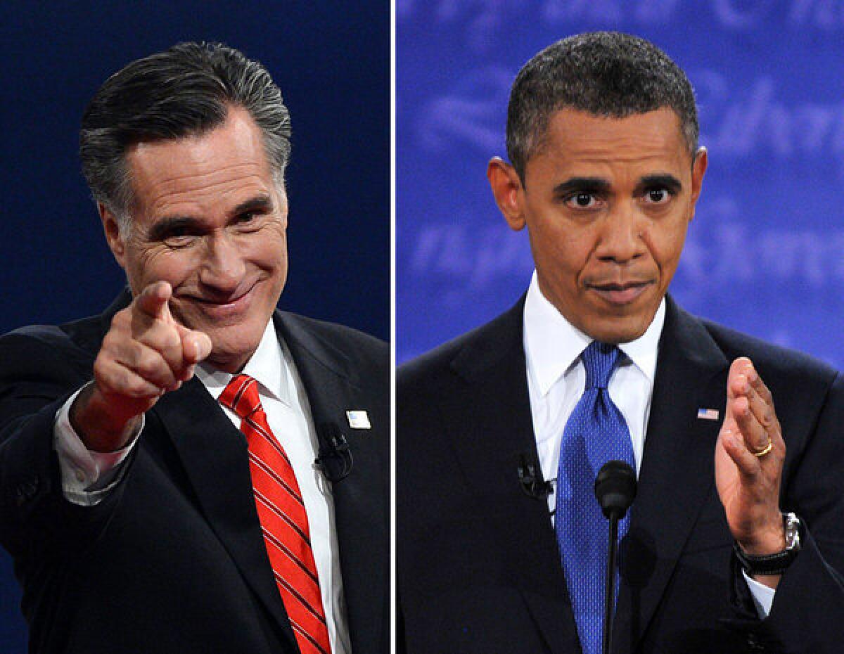 President Obama, right, speaks during his debate with Republican Presidential candidate Mitt Romney, who greets the audience at the conclusion in Denver, Colo.