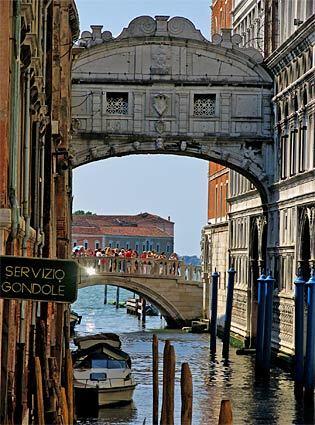 The Bridge of Sighs, which spans the Rio di Palazzo and features windows with stone bars, leads to the Doge's Palace. The view from the enclosed bridge was the last sight of Venice that convicts saw before their imprisonment.