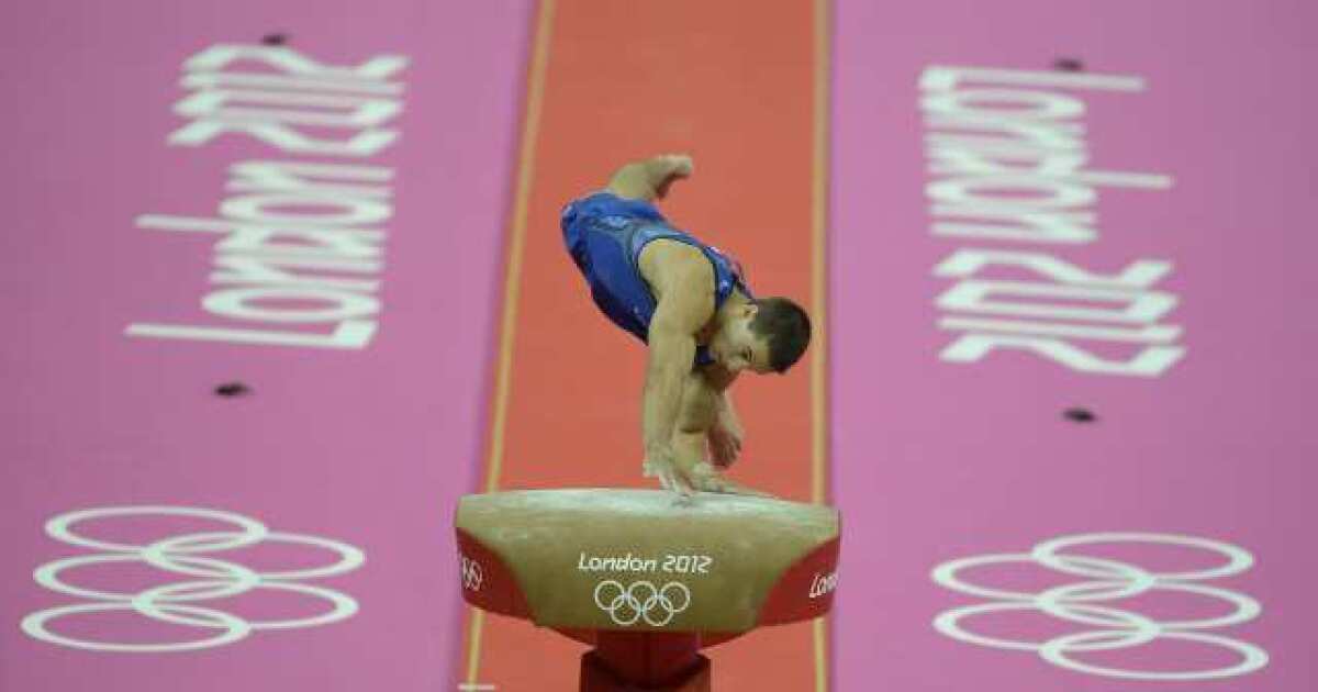 Jake Dalton competes in the vault.