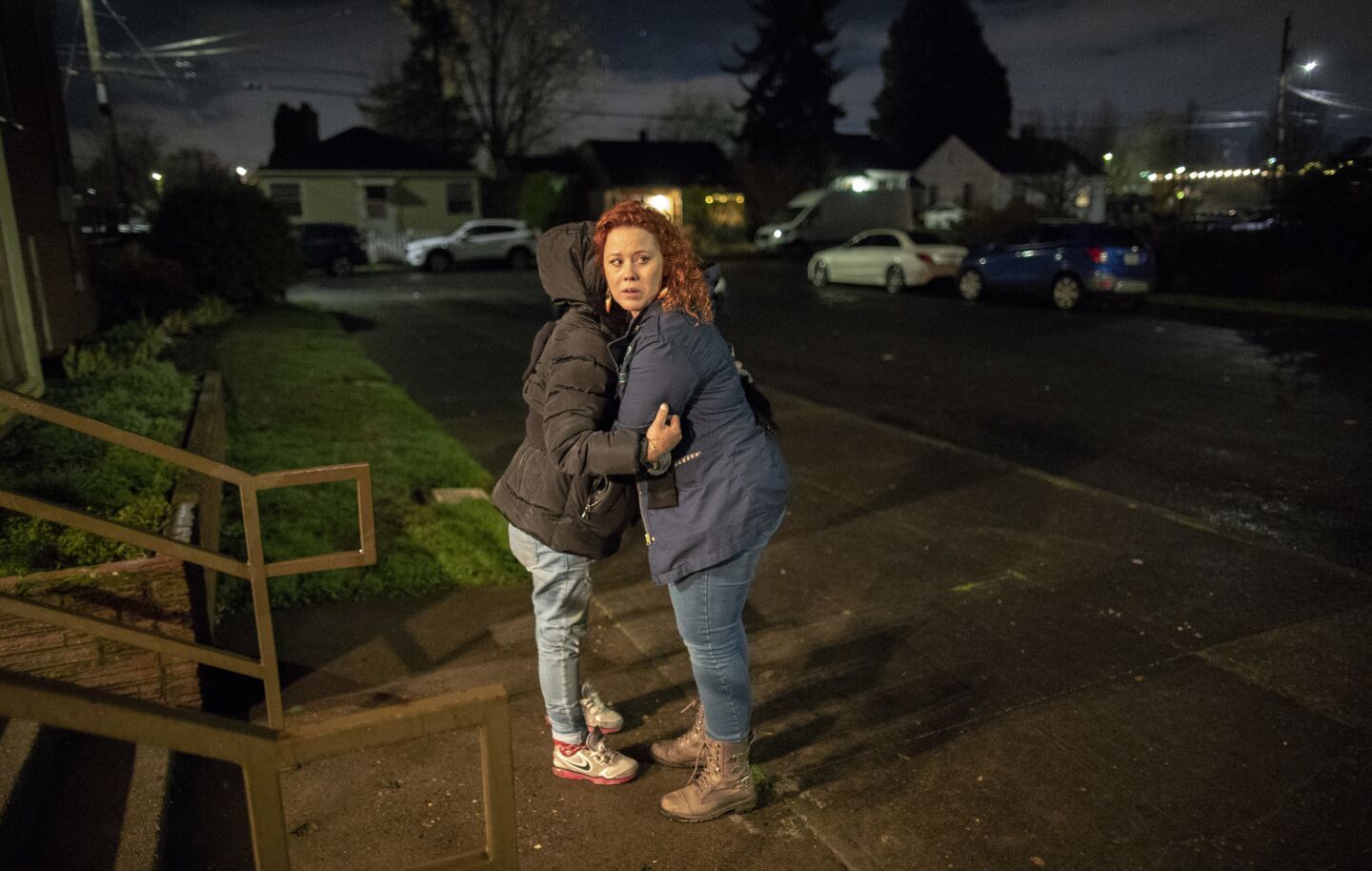 Montavilla Initiative Chairwoman Angela Todd, right, embraces homeless woman Nina Lopez, whom she met on the street while on a foot patrol with her group in Portland, Ore.