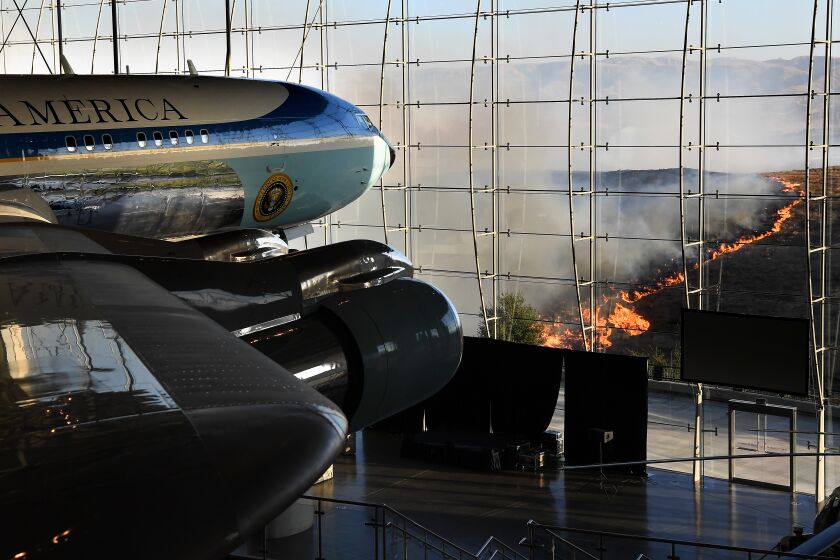 SIMI VALLEY, CALIFORNIA OCTOBER 30, 2019-President Ronald Reagan's Air Force One sits on display at the Reagan Library as the Easy Fire burns in the hills in Simi Valley Wednesday. (Wally Skalij/Los Angerles Times)