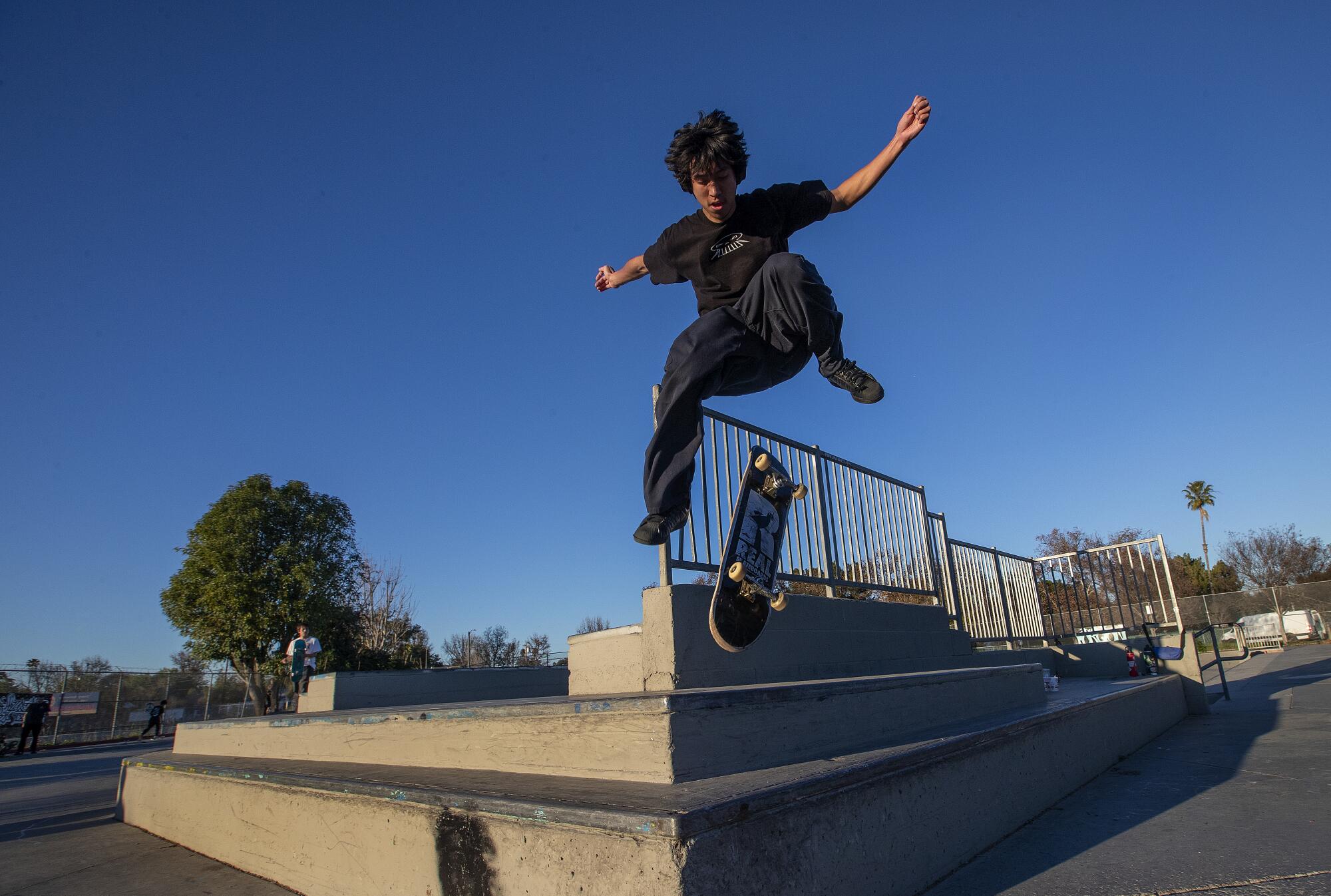 Luna Luna, 19, of Reseda, practices a hardflip while skateboarding at Pedlow Skate Park in Encino.