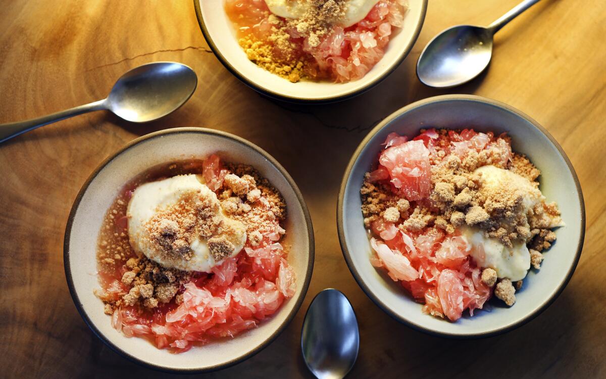 Pomelo with yogurt cream and sweet crumbles