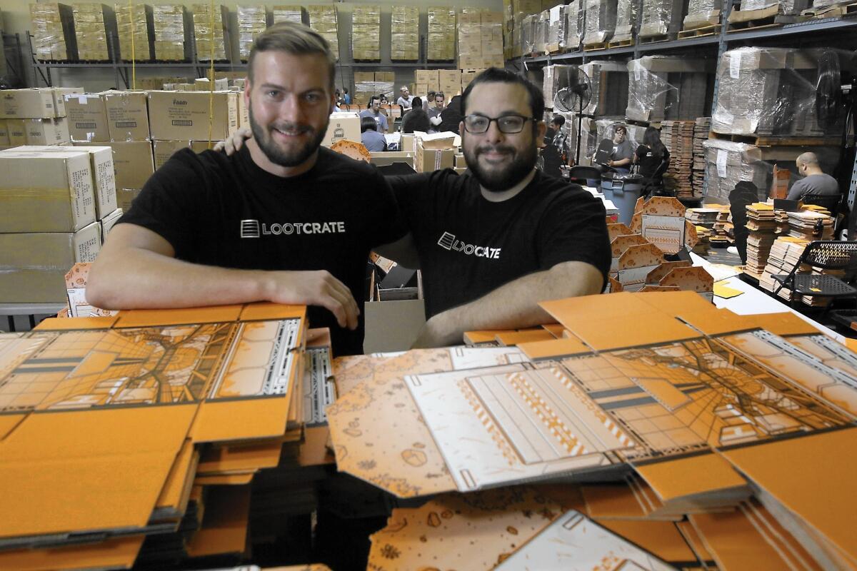 Chris Davis, left, and Matthew Arevalo are co-founders of Loot Crate, a 2-year-old company that for about $20 a month sends people a box full of products that appeal to geeks and video game and comic fanatics.