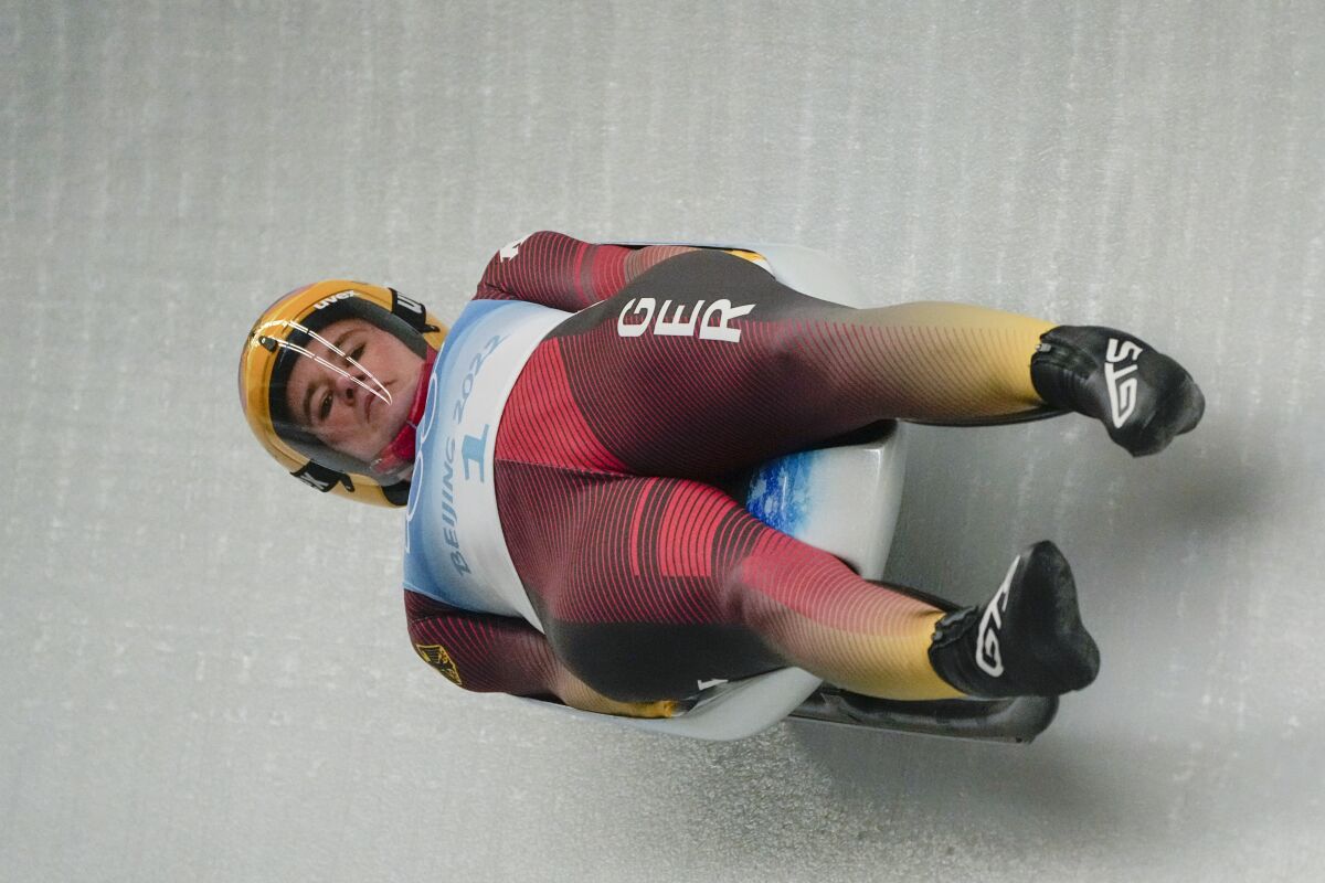 Natalie Geisenberger, of Germany, slides during the luge women's singles run 2 at the 2022 Winter Olympics, Monday, Feb. 7, 2022, in the Yanqing district of Beijing. (AP Photo/Pavel Golovkin)