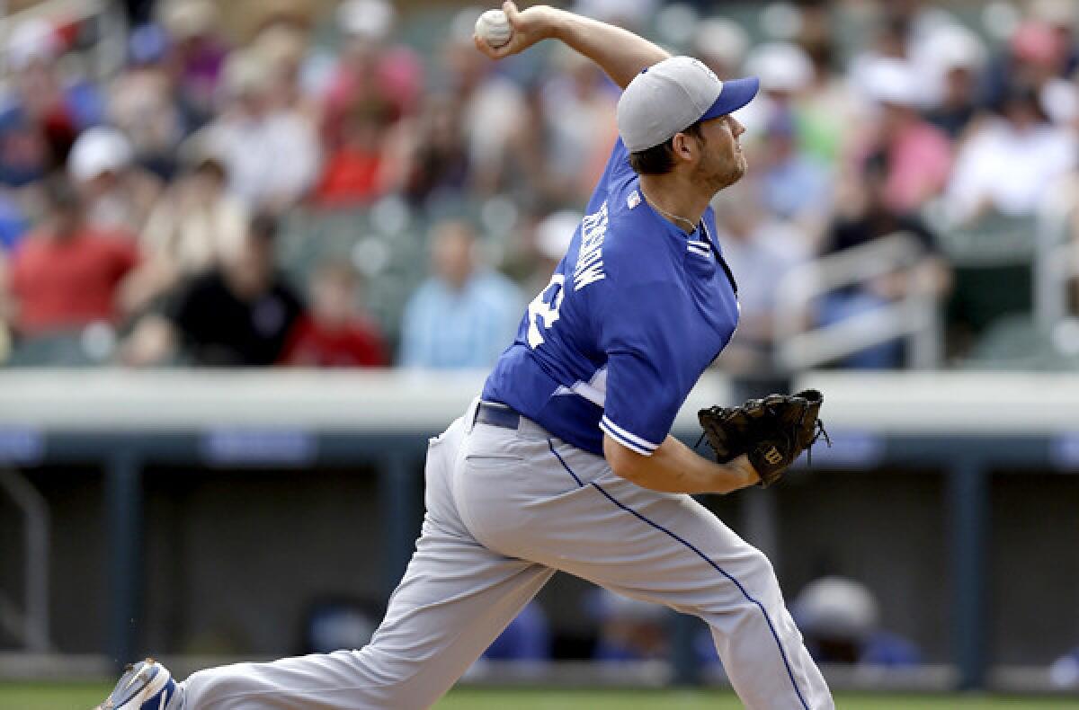Dodgers ace Clayton Kershaw delivers a pitch in the first inning of his two-inning stint against the Arizona Diamondbacks in the two teams' exhibition opener Wednesday at Scottsdale, Ariz.