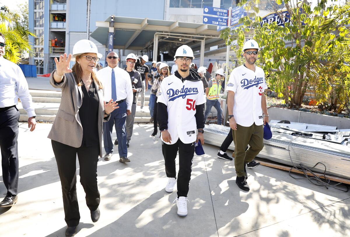 Mookie Betts, center, and David Price, right, are given a tour of the construction at Dodger Stadium on Feb. 12.