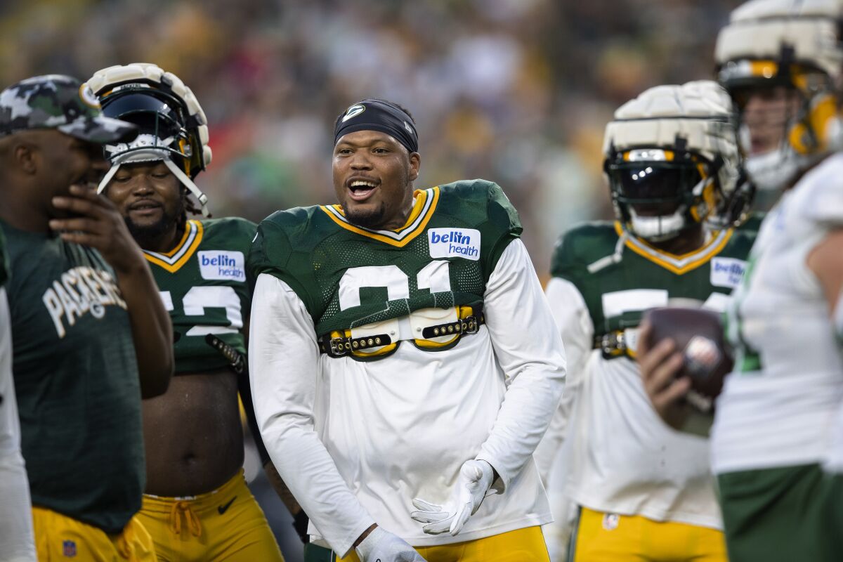 Green Bay Packers linebacker Preston Smith (91) reacts during drills in NFL football practice at Packers Family Night on Friday, Aug. 5, 2022, at Lambeau Field in Green Bay, Wis. (Samantha Madar/The Post-Crescent via AP)
