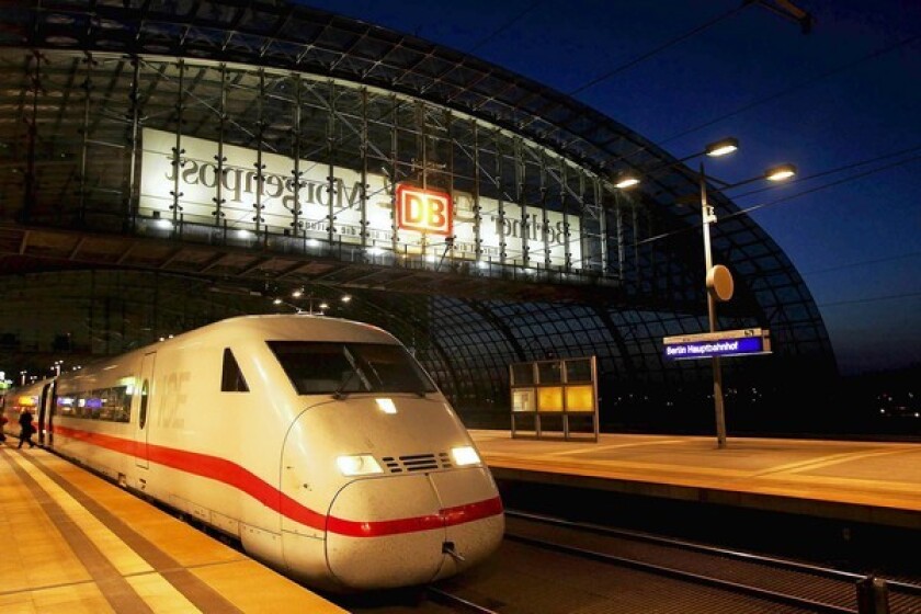 A high-speed Intercity Express train operated by the German national railway leaves the Berlin Hauptbahnhof.