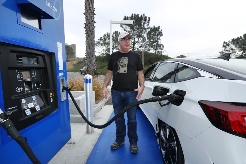 Chris Schneider fills up his hydrogen fuel cell Honda Clarity at the Shell station in Carmel Valley.  