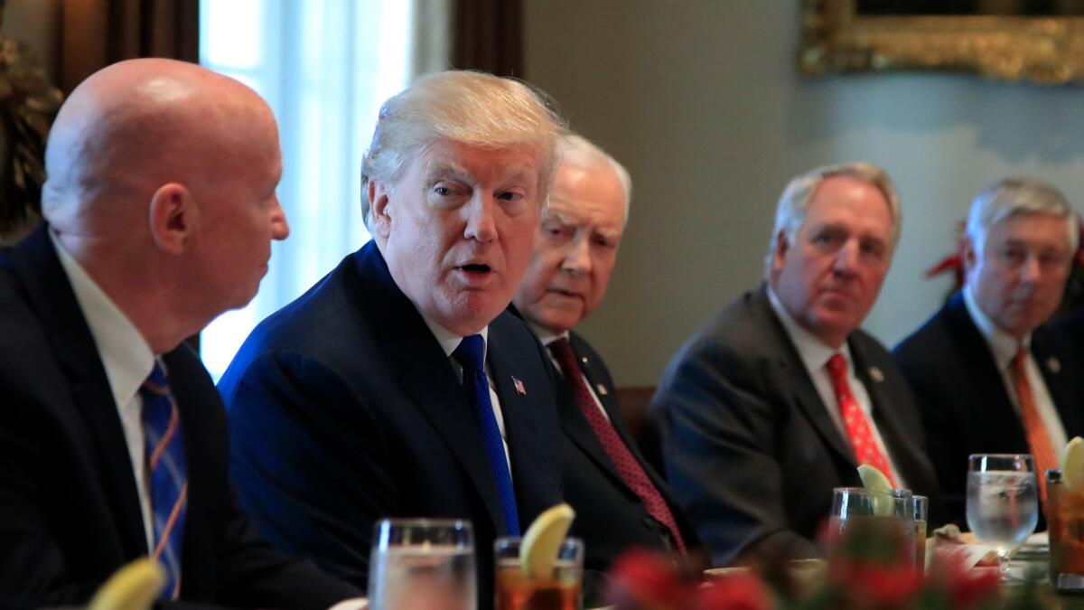 President Trump met with GOP lawmakers working on the tax bill before its passage in December: From left, House Ways and Means Chairman Kevin Brady of Texas, Sen. Orrin Hatch of Utah, Rep. John Shimkus of Illinois and Rep. Fred Upton of Michigan.