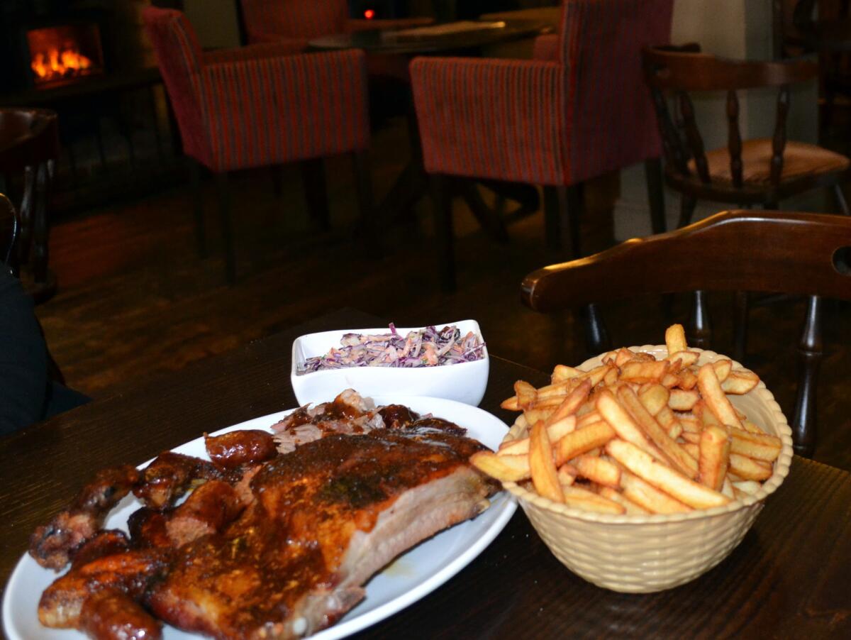 Sal's Smokehouse inside the Lion pub in Newbury, Britain, serves ribs, pulled pork and more as American-style barbecue.