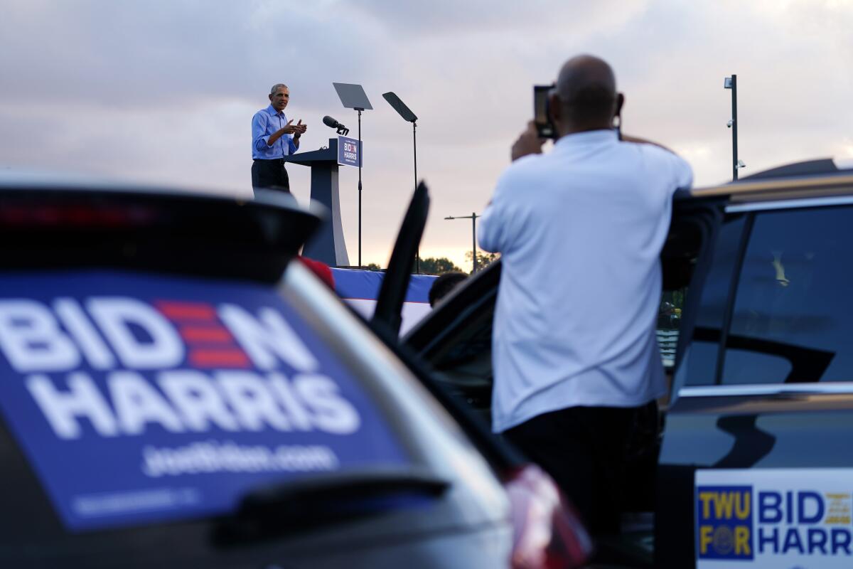 Rallygoers watch former President  Obama from their cars at a "drive-in" rally for Joe Biden in Philadelphia.