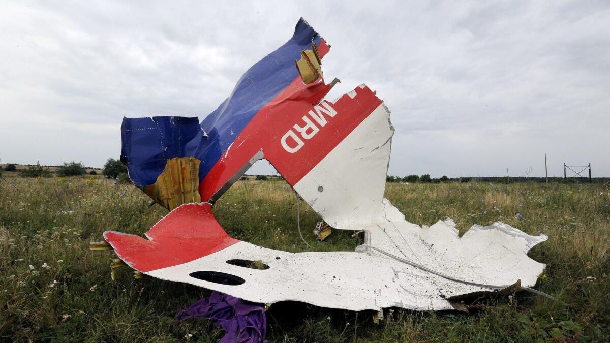A piece of wreckage of Malaysia Airlines flight MH17 sits in a field in Shaktarsk, eastern Ukraine, on July 18, 2014.