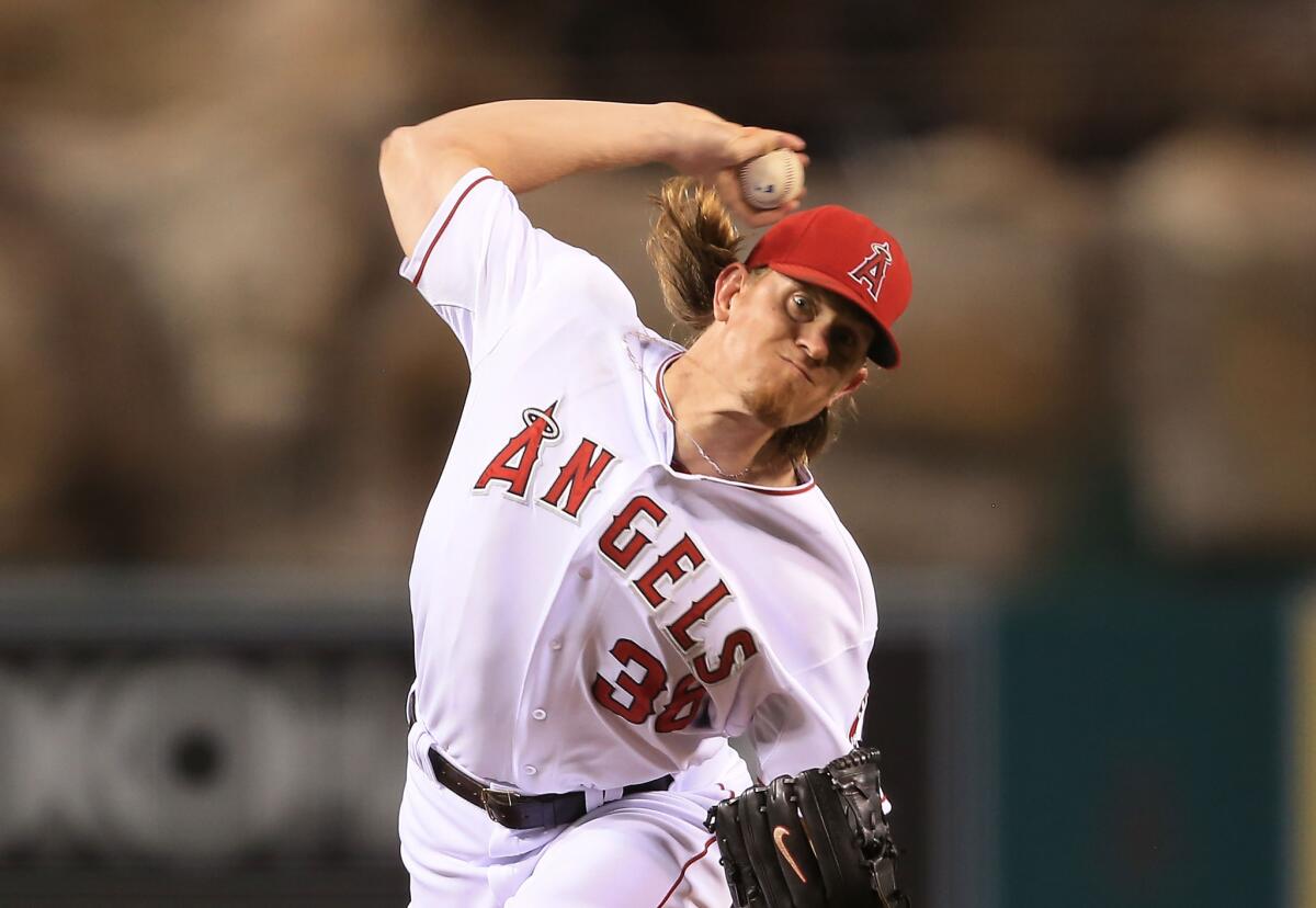 Jered Weaver allowed two runs and struck out seven in seven innings against Texas on Saturday night.