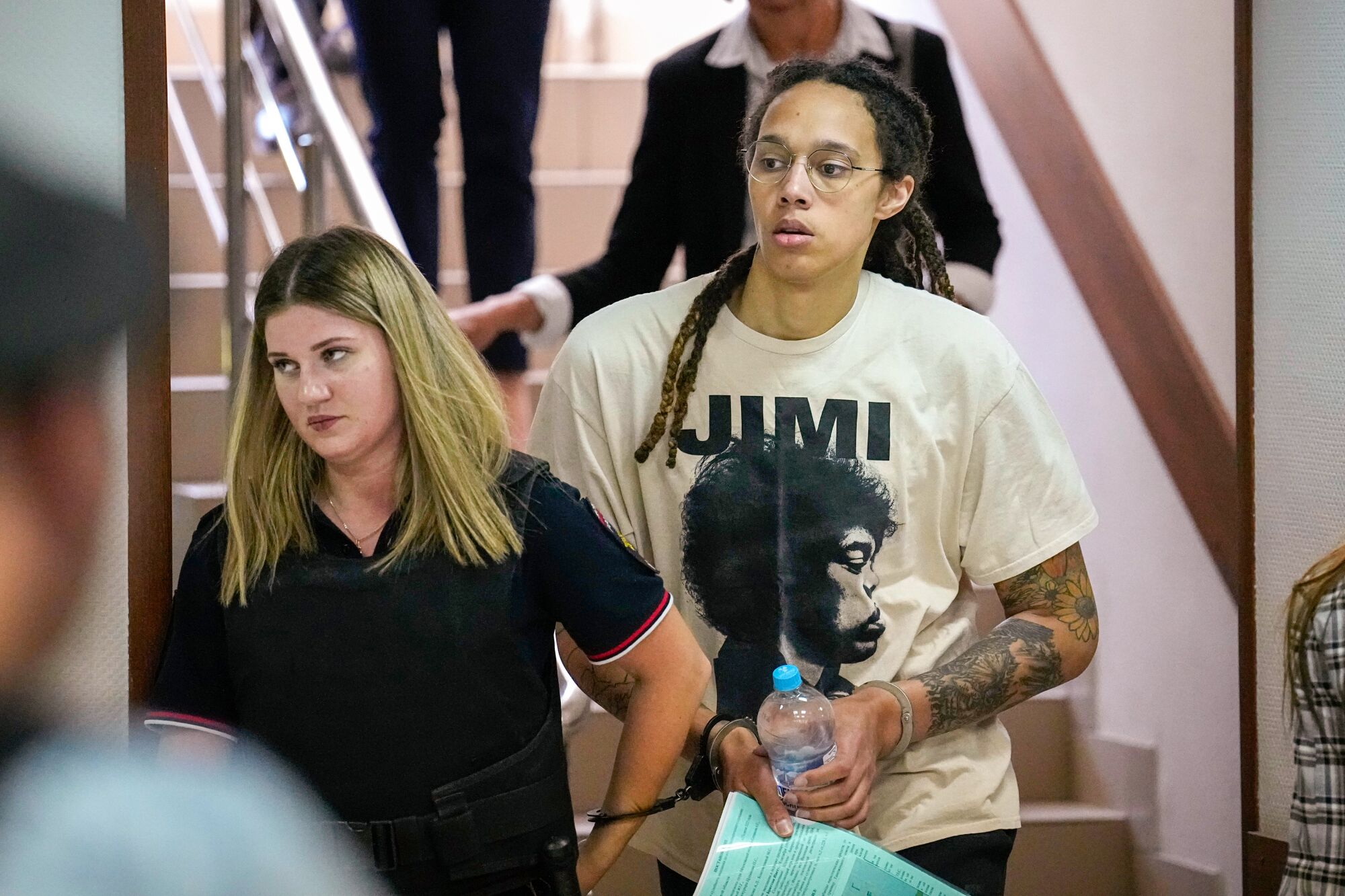 WNBA star and two-time Olympic gold medalist Brittney Griner is escorted to a courtroom in Moscow.