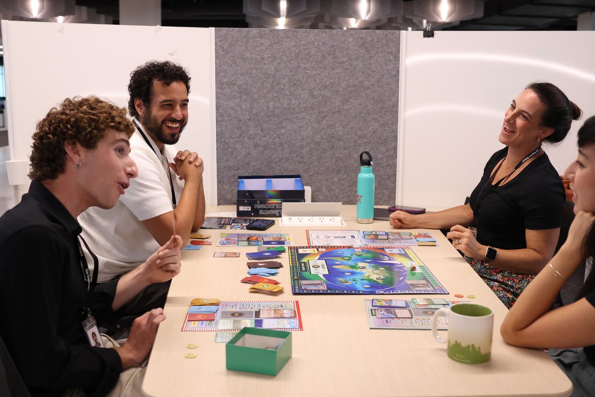 Times staffers play a board game.