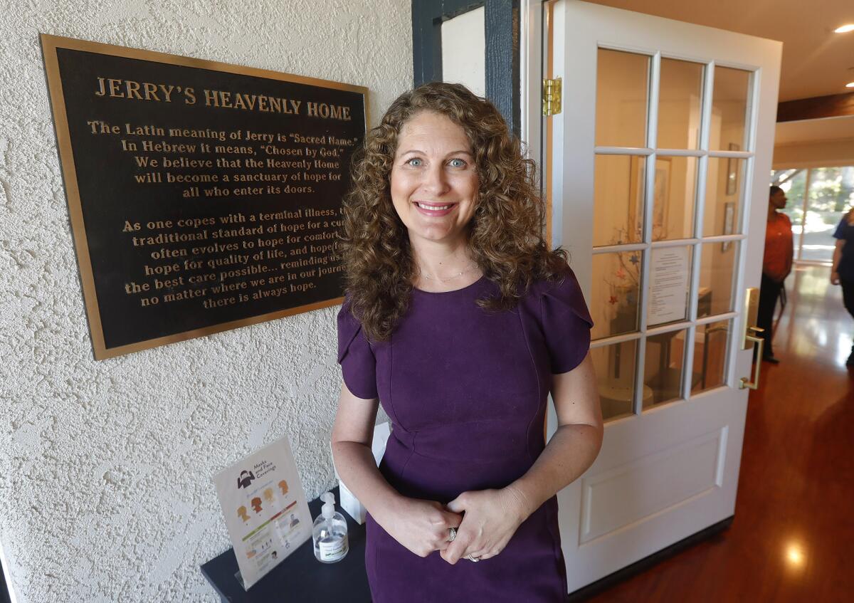 Michelle Wulfestieg stands outside "Jerry's Heavenly Home" in Mission Viejo on Tuesday.