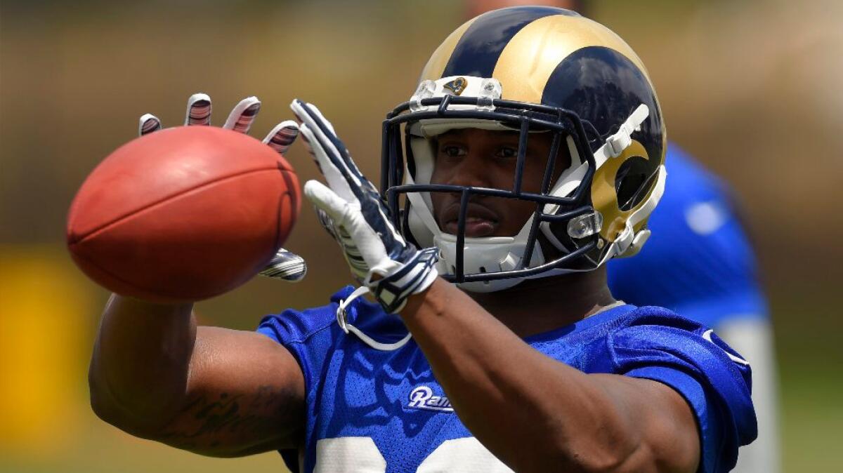 Rams running back Benny Cunningham catches a pass during minicamp in Oxnard on June 14.