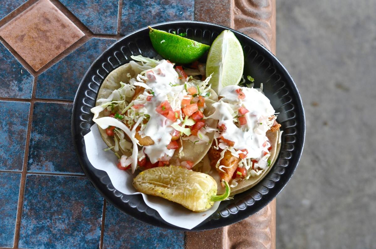 Love fish tacos? Head to La Puente, where the original Taco Nazo, whose fish tacos are pictured here, and Colonia Taco Lounge are right next door.