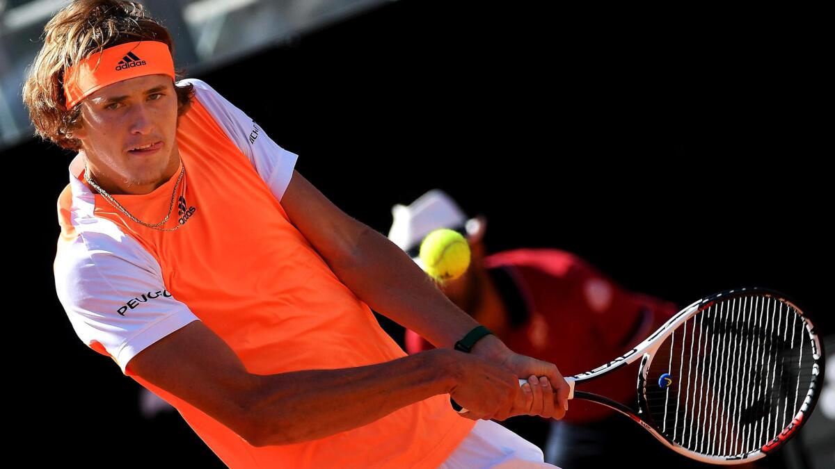 Alexander Zverev returns a shot against John Isner during an Italian Open semifinal on Saturday.