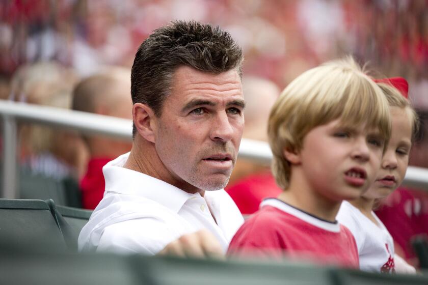 ST. LOUIS, MO - AUGUST 18: Former St. Louis Cardinals player Jim Edmonds sits in the stands with his family during the game between the Pittsburgh Pirates and the St. Louis Cardinals at Busch Stadium on August 18, 2012 in St. Louis, Missouri. (Photo by David Welker/Getty Images)