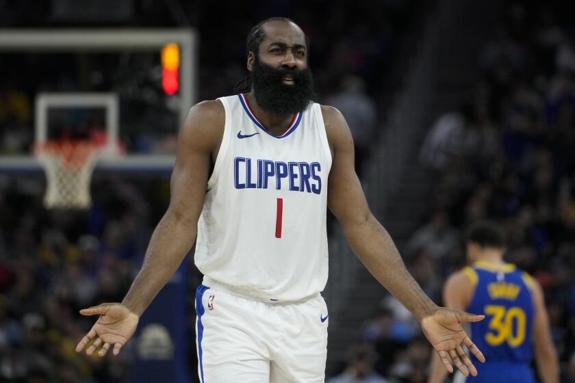 Los Angeles Clippers guard James Harden reacts after being called for a foul during the first half.