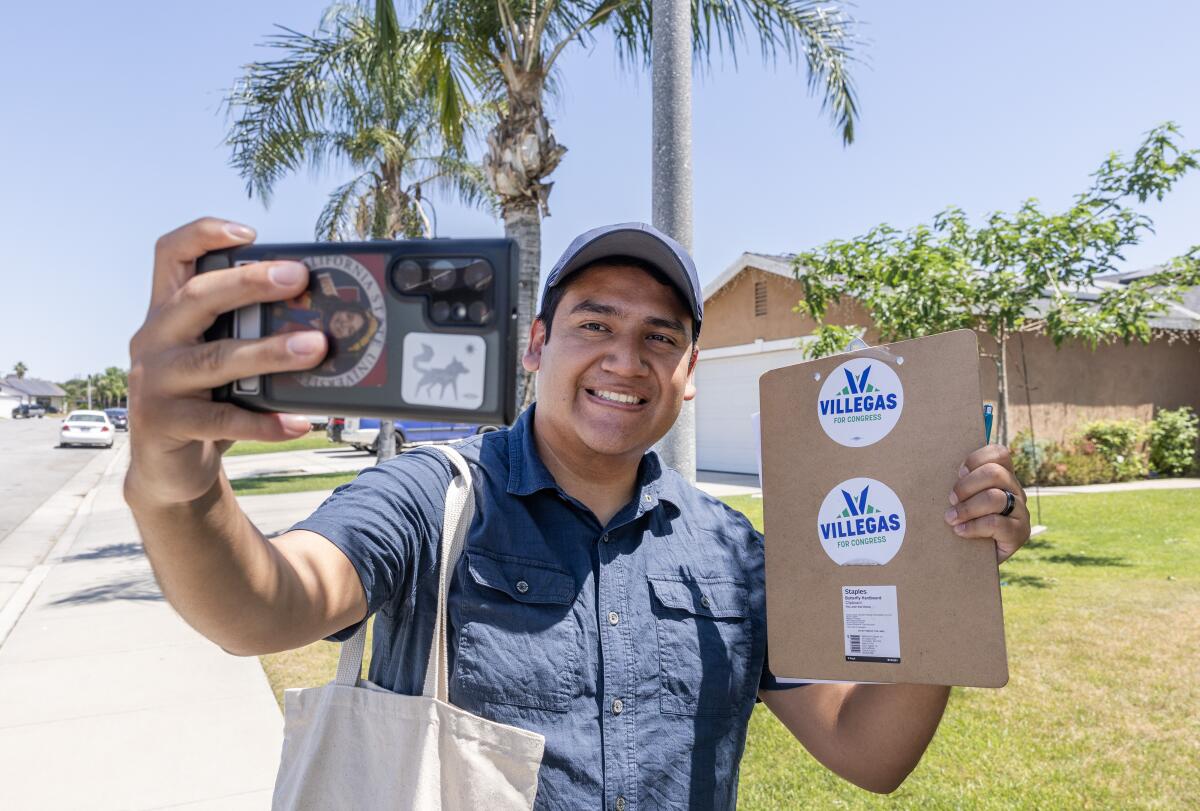 Randy Villegas takes frequent selfies for their social media while walking neighborhoods in Bakersfield.