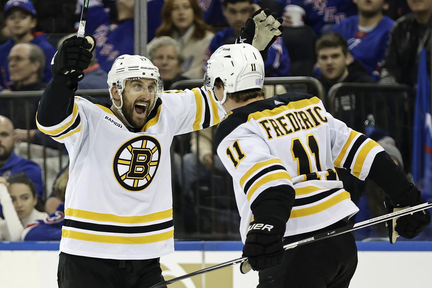Charlie Coyle of the Boston Bruins is congratulated by Nick Foligno