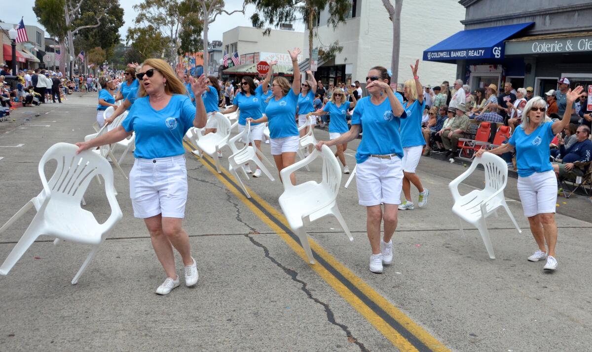 The Patio Chair Drill Team dance along Marine Avenue at the Balboa Island Parade Sunday.