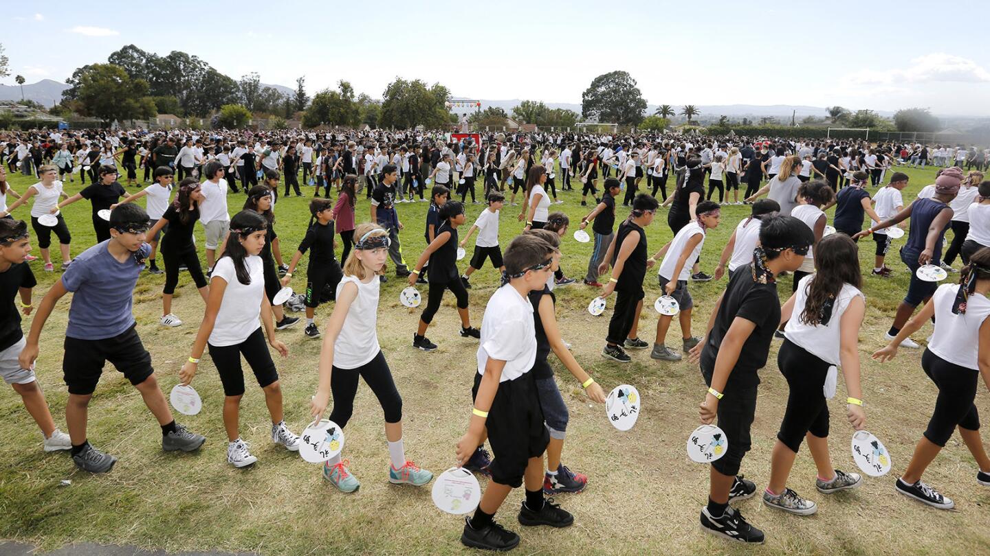 Photo Gallery: Muir Middle School attempts to break fan dance world record