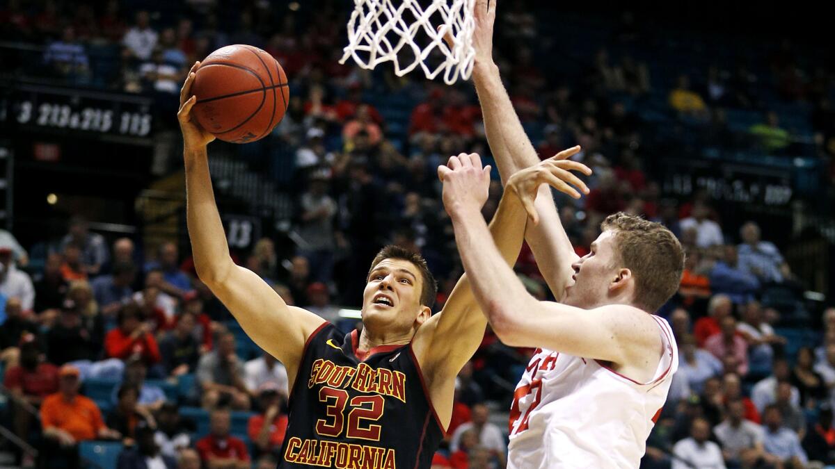 USC forward Nikola Jovanovic tries to score against Utah forward Jakob Poeltl during the first half of a game in March.