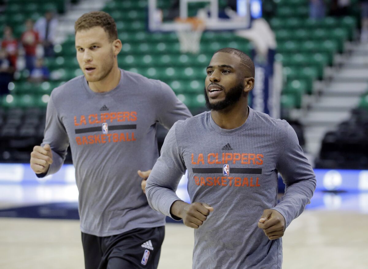 Clippers guard Chris Paul, right, and Blake Griffin run during a practice before a game against the Utah Jazz on Oct. 17.
