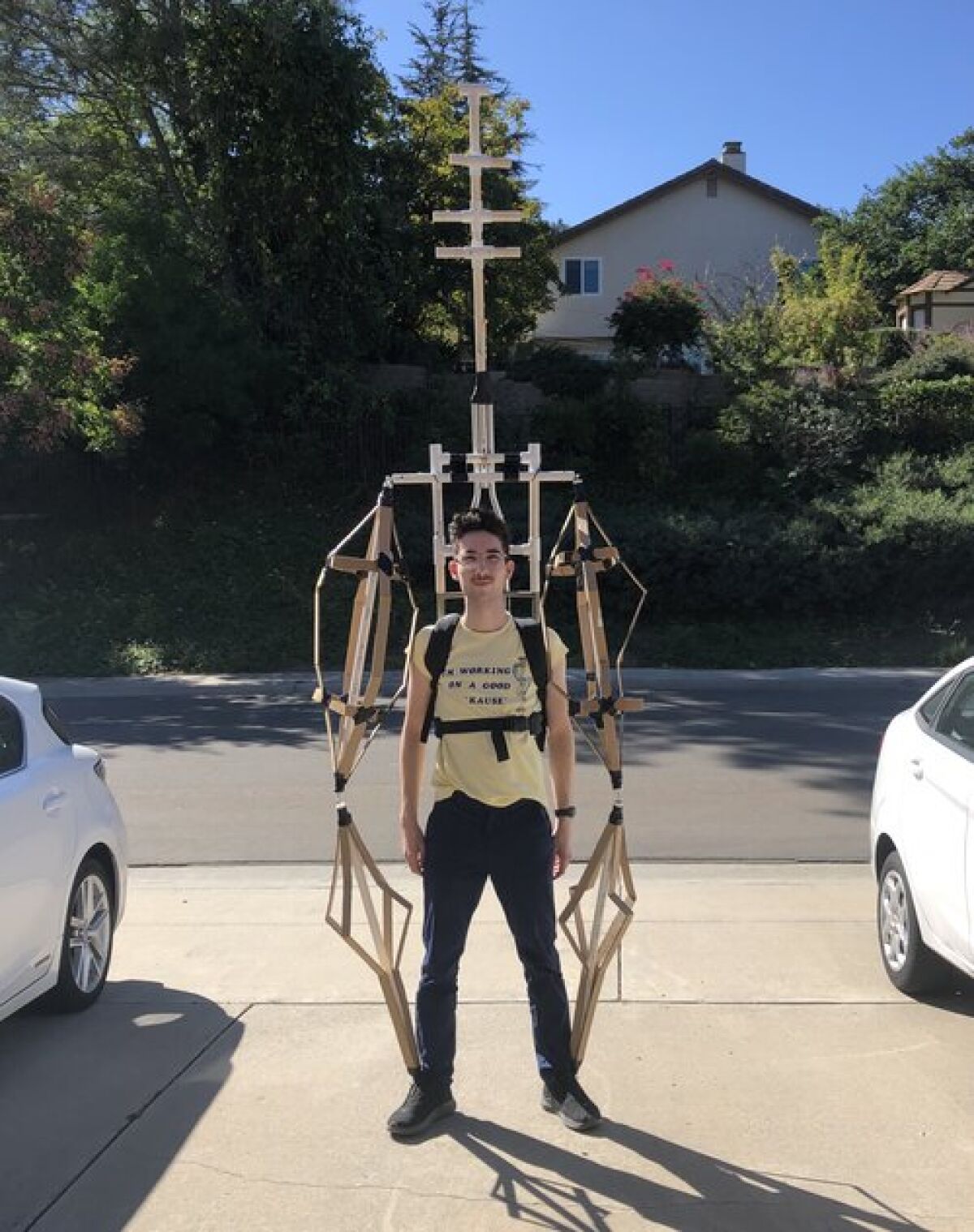 Jacob Surovsky wearing the skeleton of the puppet at his home.