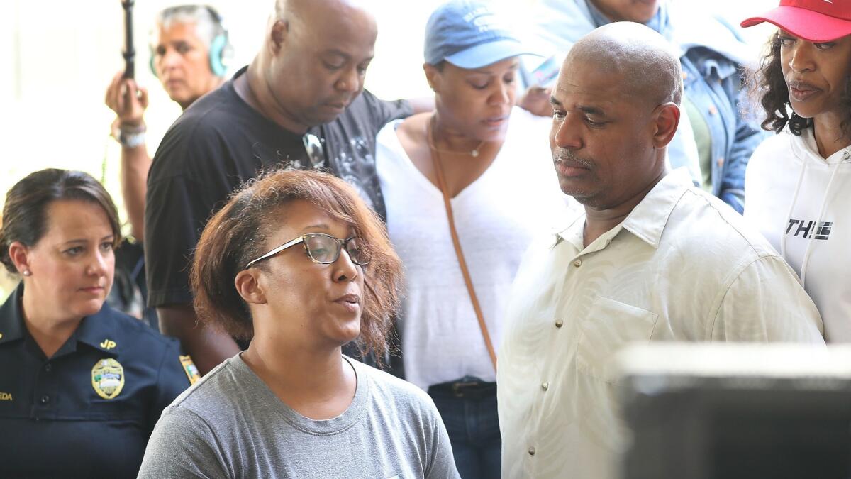 Relatives of Elijah Clayton address the media on Monday after he was killed during a shooting at GLHF Game Bar at the Jacksonville Landing the day before in Jacksonville, Fla.