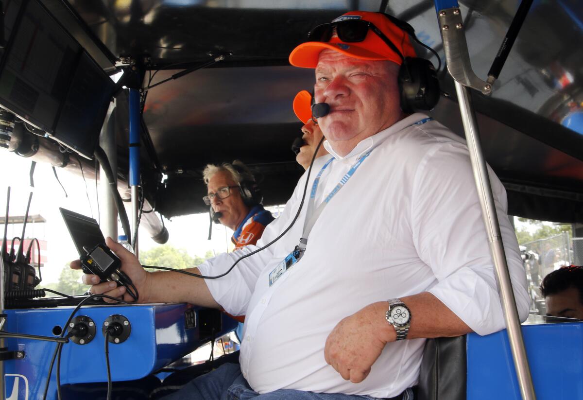 Car owner Chip Ganassi looks on from pit road during an IndyCar race at Mid-Ohio Sports Car Course in Lexington, Ohio, Sunday, July 4, 2021. (AP Photo/Tom E. Puskar)