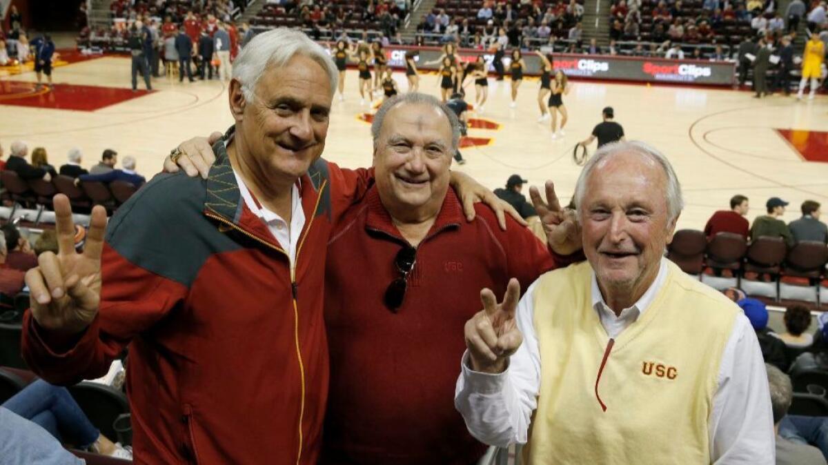 From left: John Colich, Ron Laraneta and Fred Crook, members of the Road Warrior group who passionately follow USC to away games, attend the Trojans' home game against Washington State on March 1.