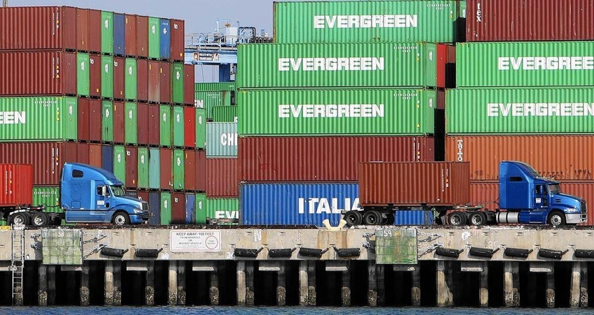 Trucks in San Pedro begin to clear the cargo backlog at the ports of Long Beach and Los Angeles.