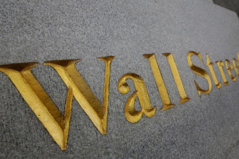 "Wall Street" is etched in the facade of a building in New York's financial district.