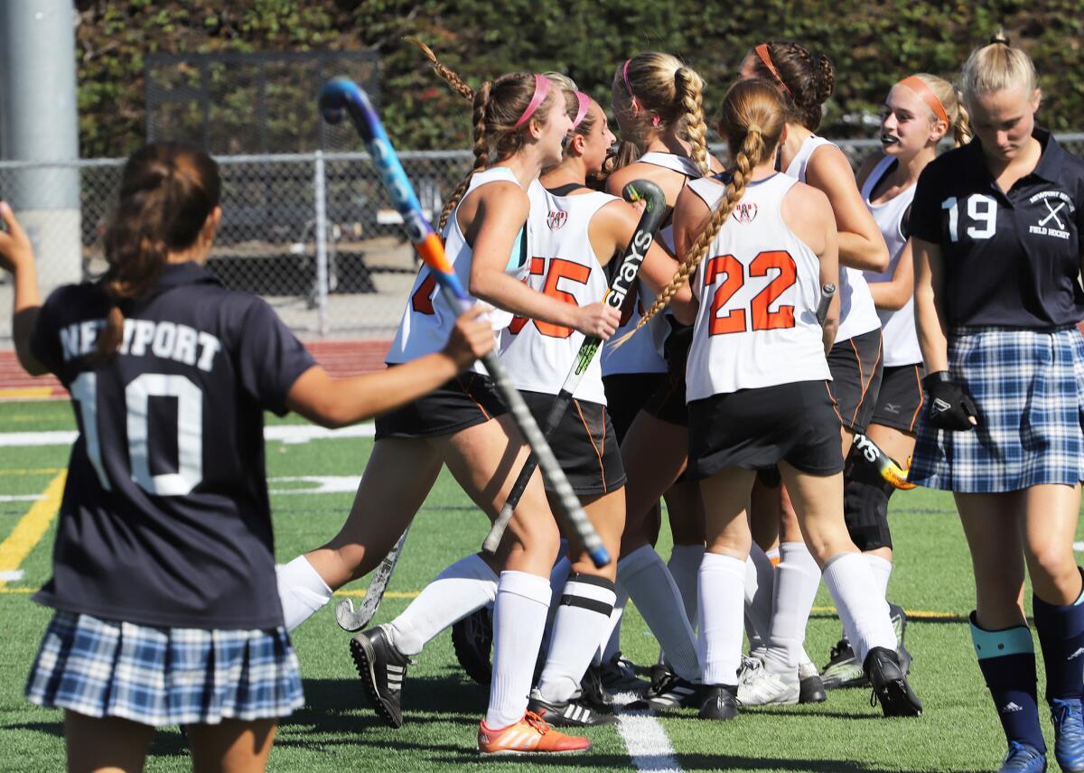 Sarah Low (99) scores for Huntington Beach in the Los Angeles Field Hockey Assn. Tournament of Champions title match.