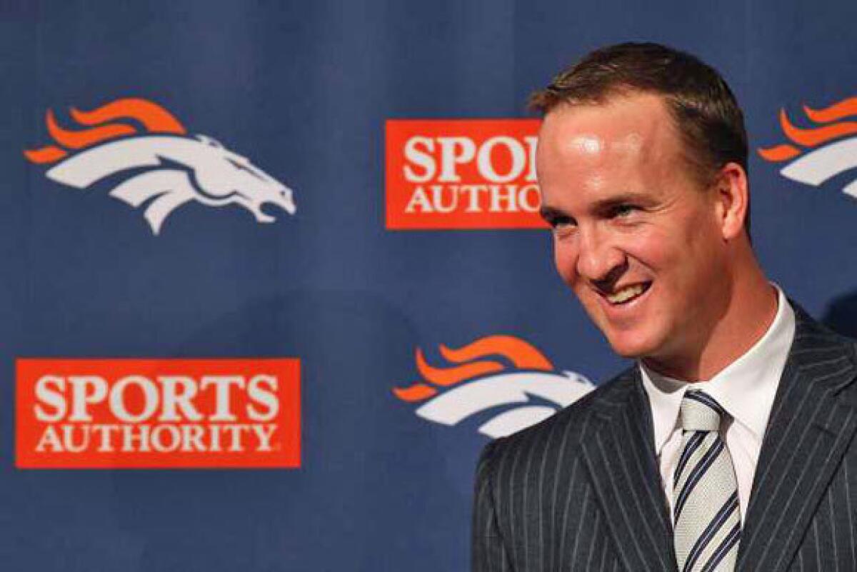 Peyton Manning speaks to the media at his news conference in Denver on Tuesday.