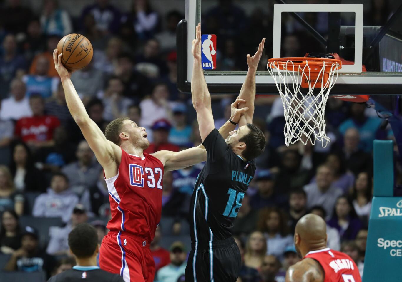 Clippers forward Blake Griffin dunks the ball over Hornets center Miles Plumlee during a game on Feb. 11.