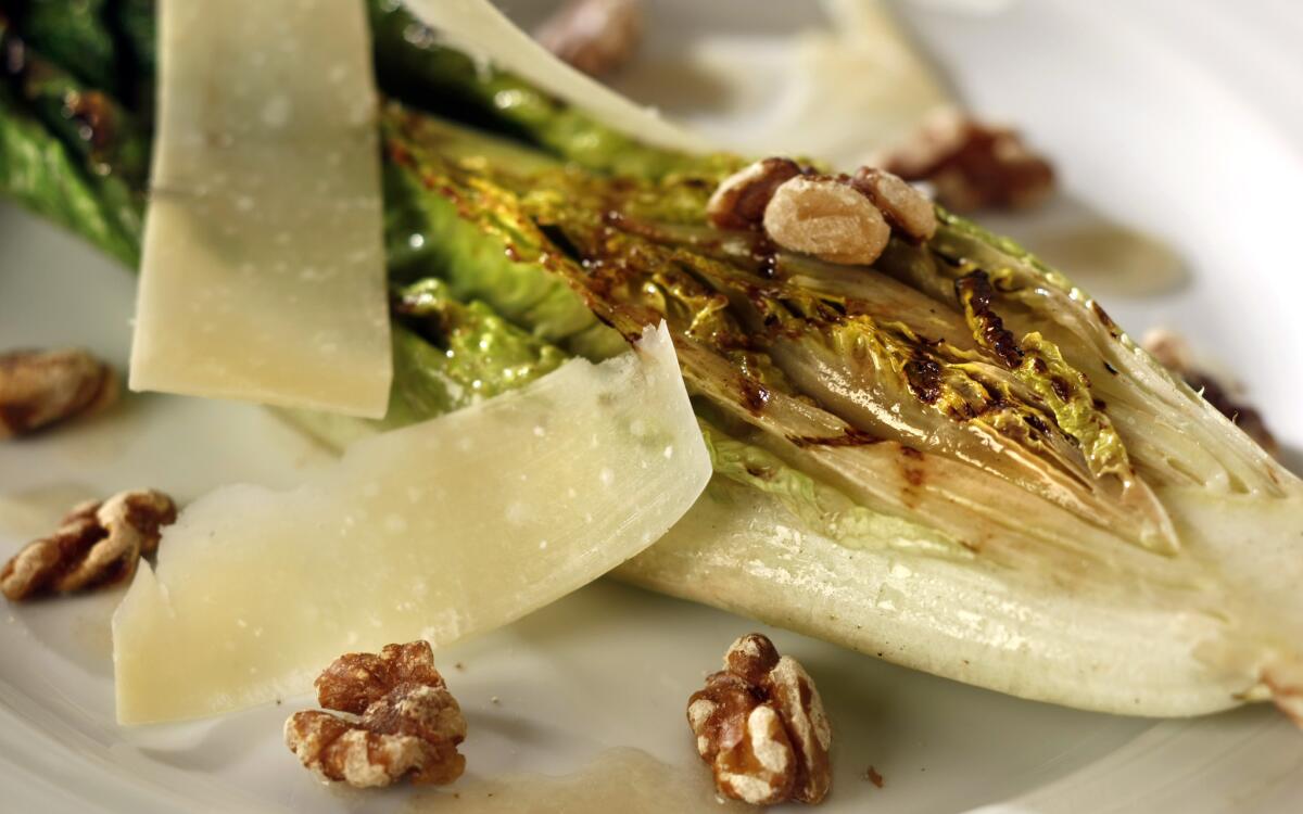 Grilled romaine with walnuts, Parmesan and anchovy dressing