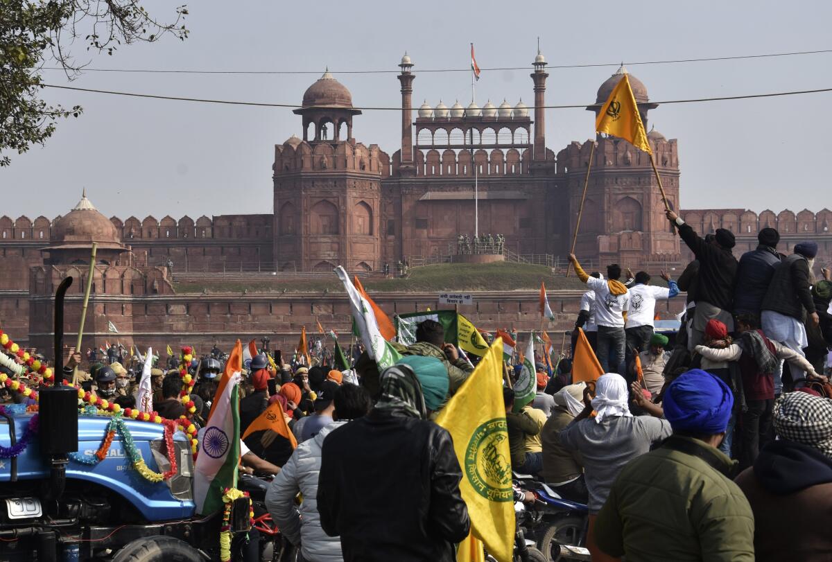 Protesting farmers arrive on tractors at New Delhi's historic Red Fort.