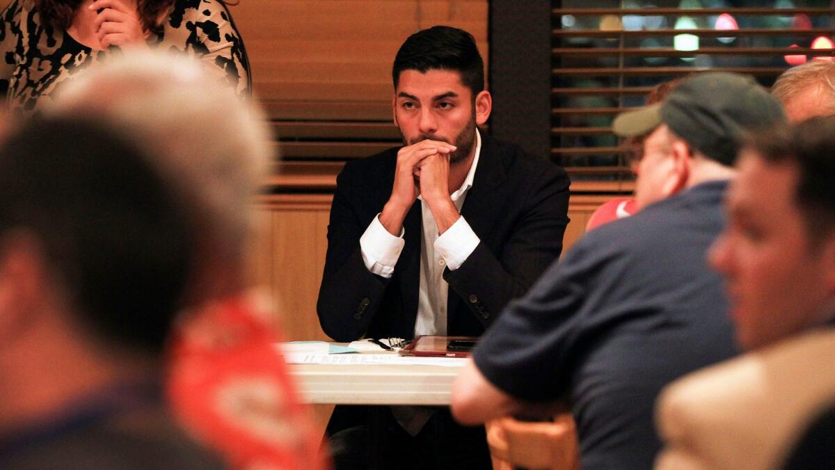 Ammar Campa-Najjar a candidate for 50th congressional district, listens during a monthly meeting of the East County Democratic Club at Jimmy's Restaurant and Bar in Santee in August.