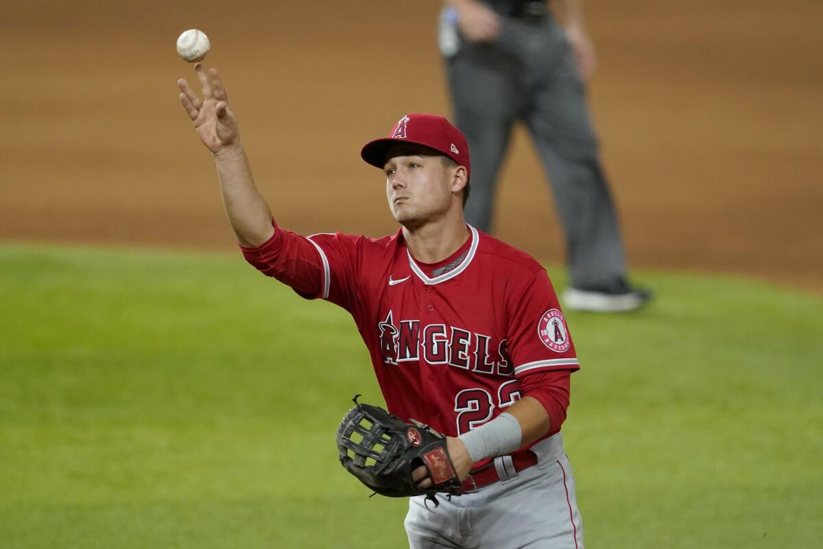 Angels second baseman Matt Thaiss throws to first for the out on a grounder by Texas Rangers' Jose Trevino.