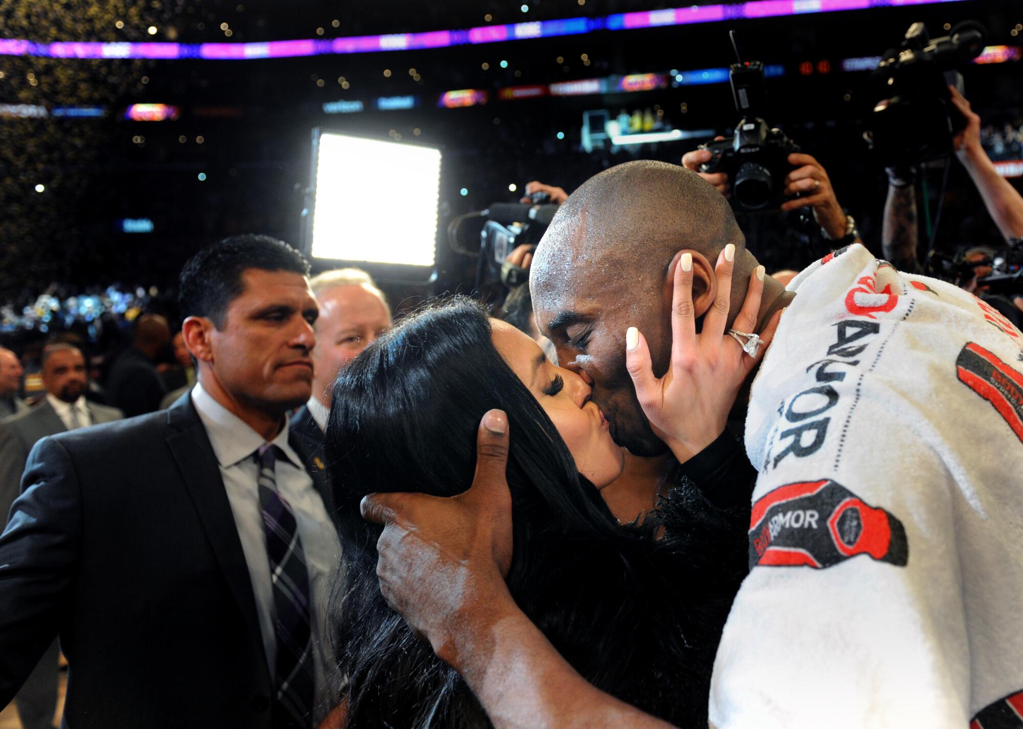 Kobe Bryant kisses his wife Vanessa after the final game of his career.