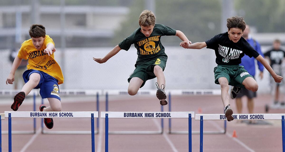 Students from Jordan, Luther Burbank and John Muir Middle Schools participated in the annual All-City Track and Field Meet at Burbank High School in Burbank on Saturday, April 13, 2013. At center is Ethan Galloway, 12 and in 6th grade, from LBMS.